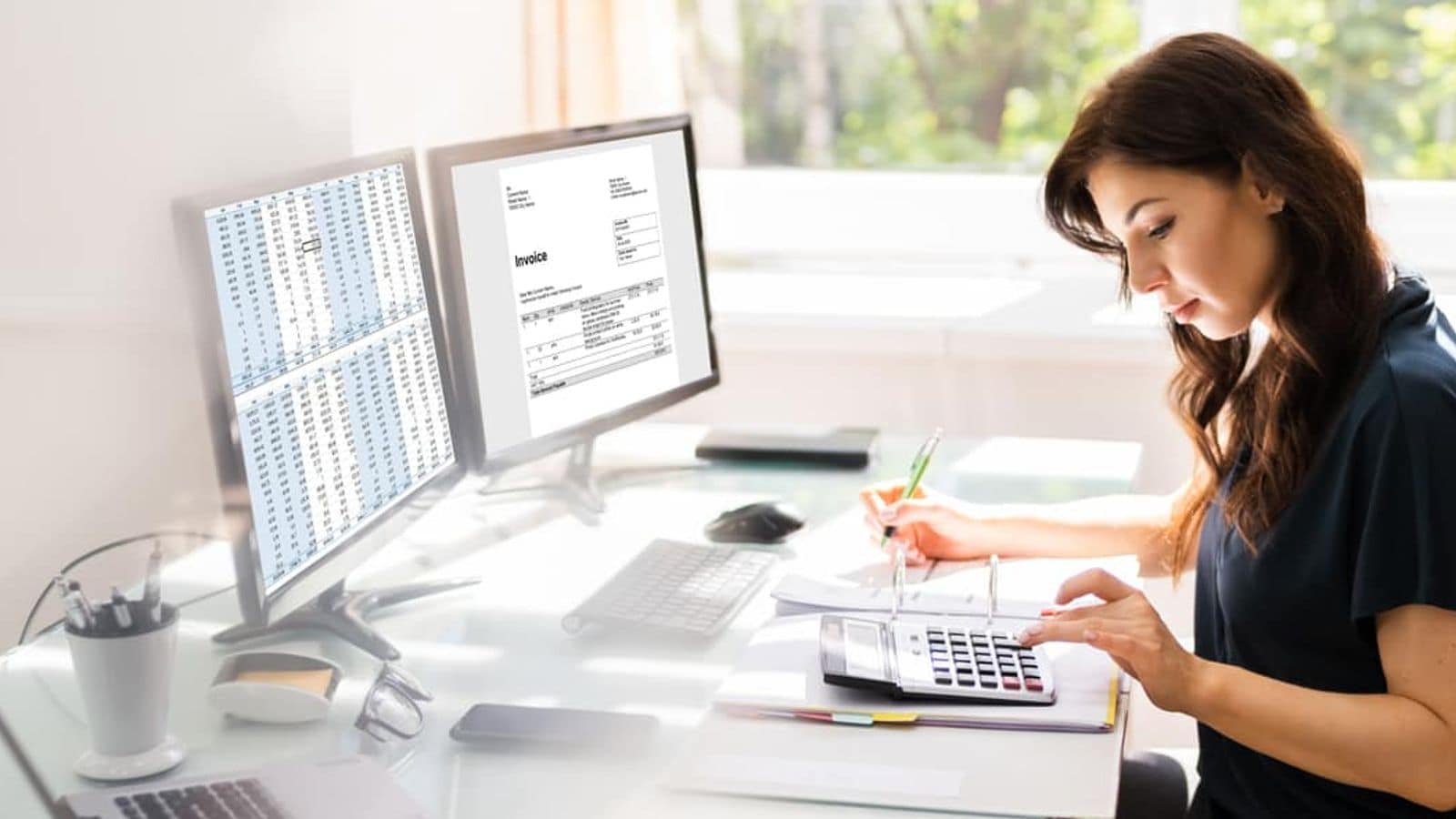 A person using invoicing software on a computer