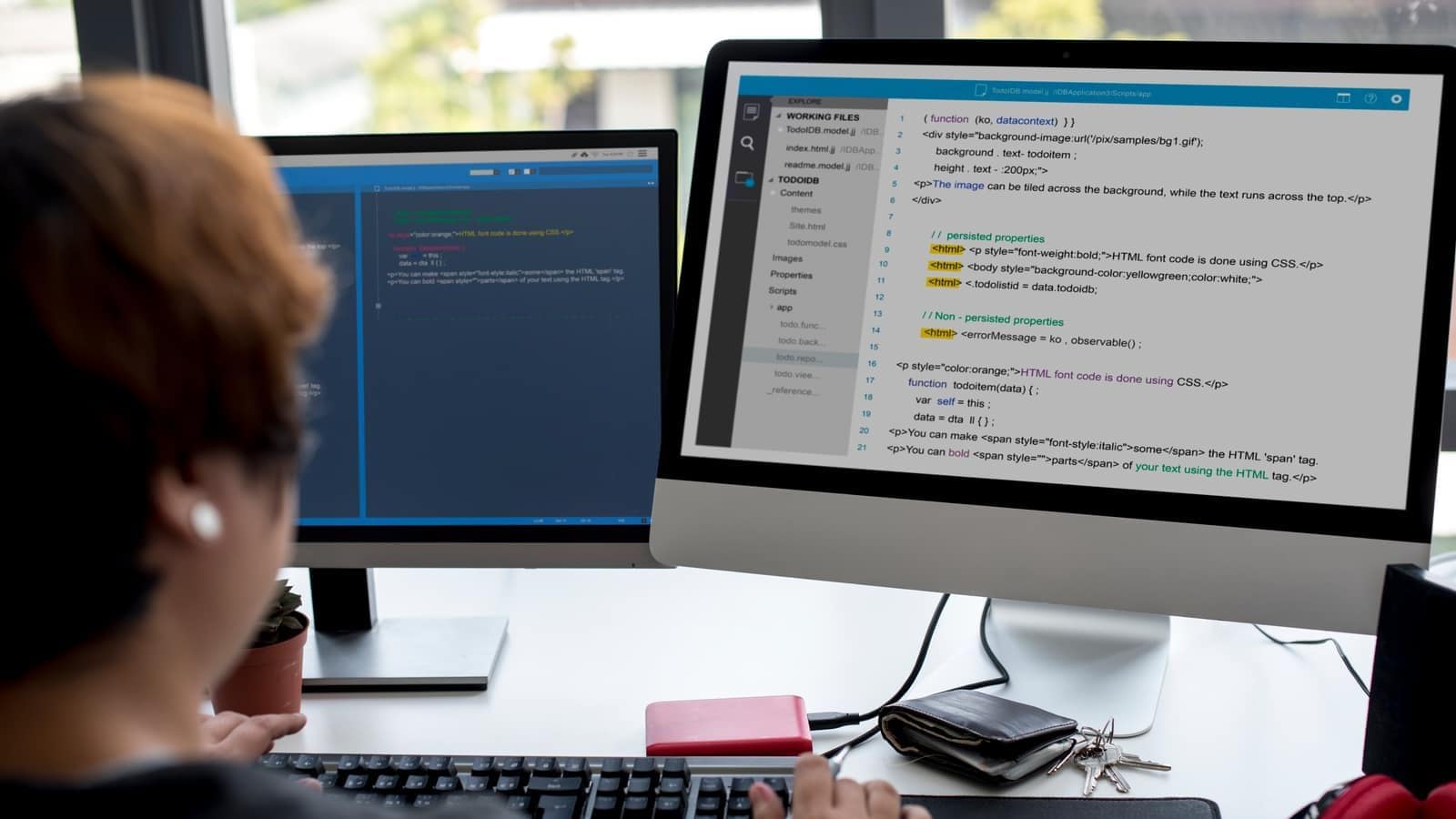 A person working at a computer screen filled with code